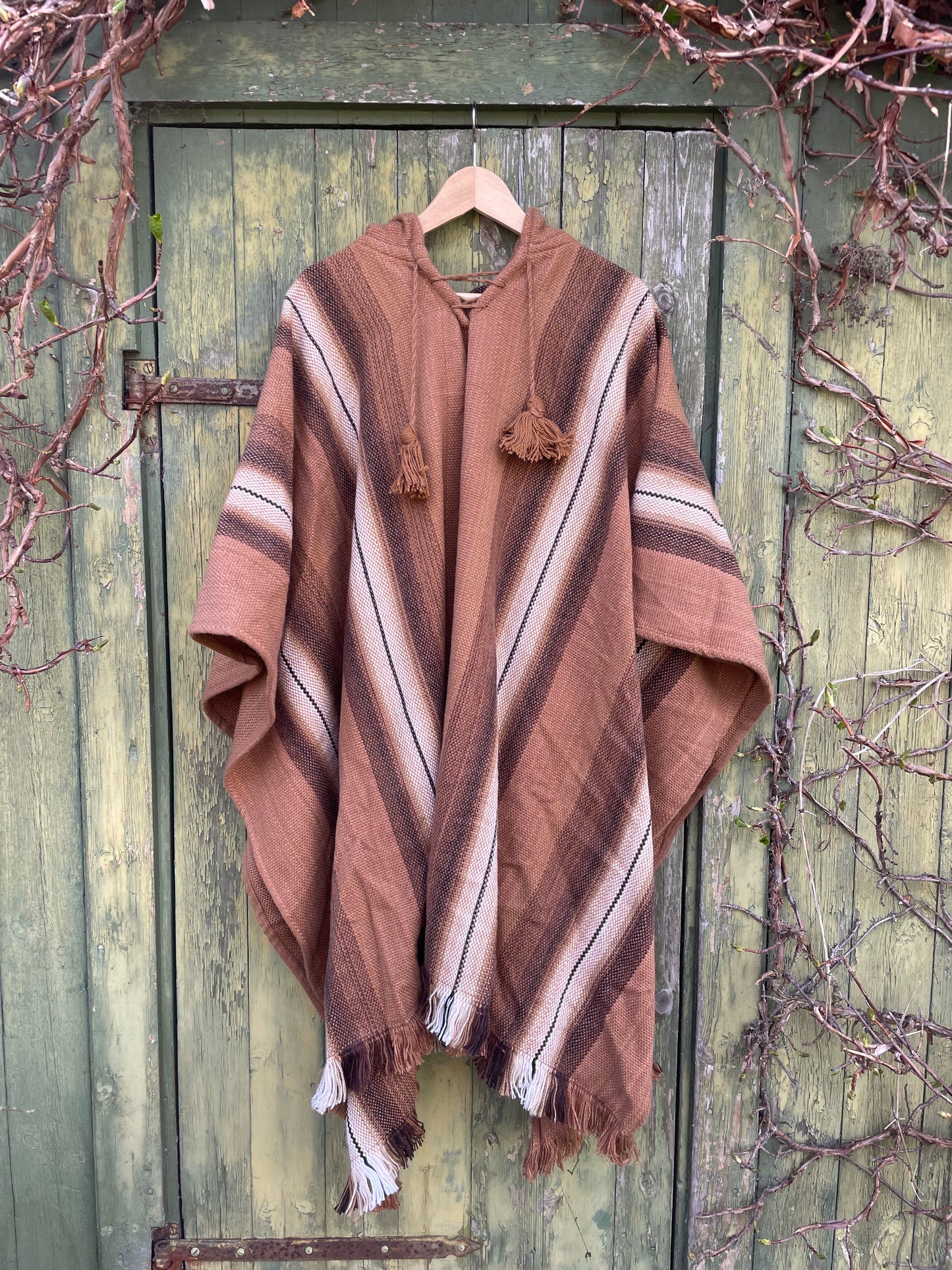 Poncho med luva