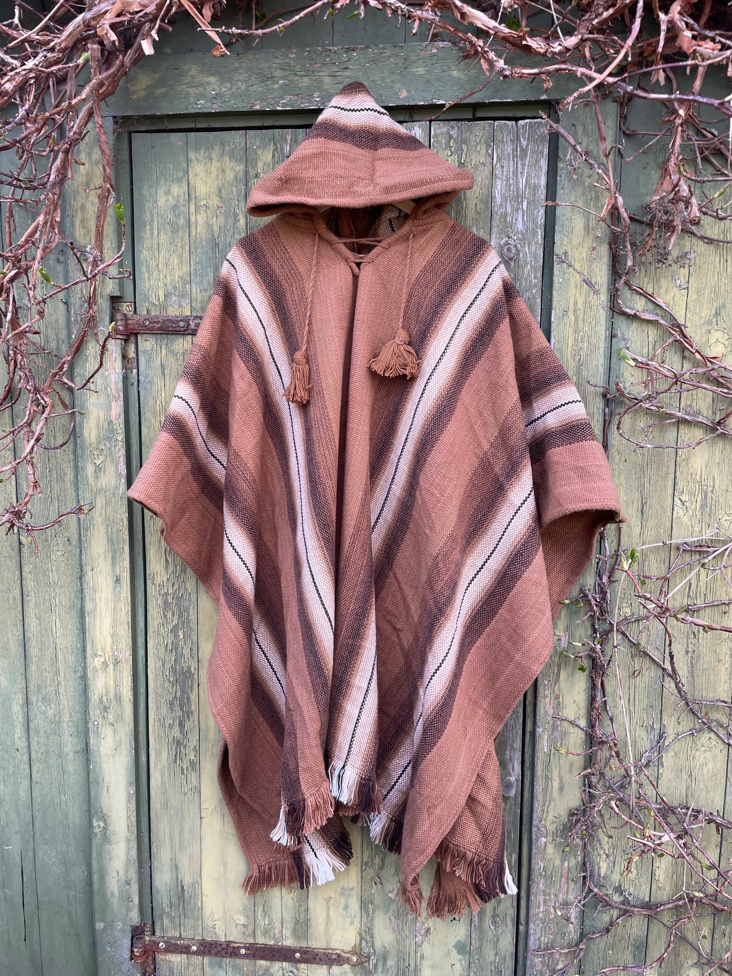 Poncho med luva